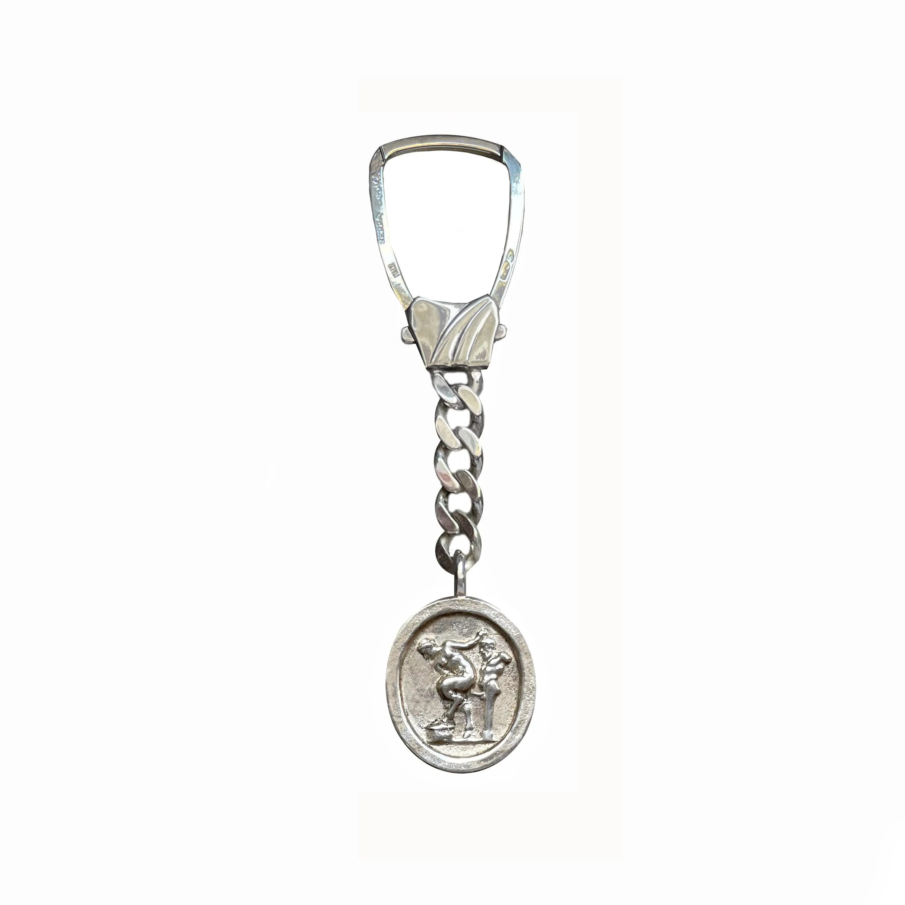 Erotic scene key chain that comes from the cast of an ancient Roman intaglio (1st century AD)